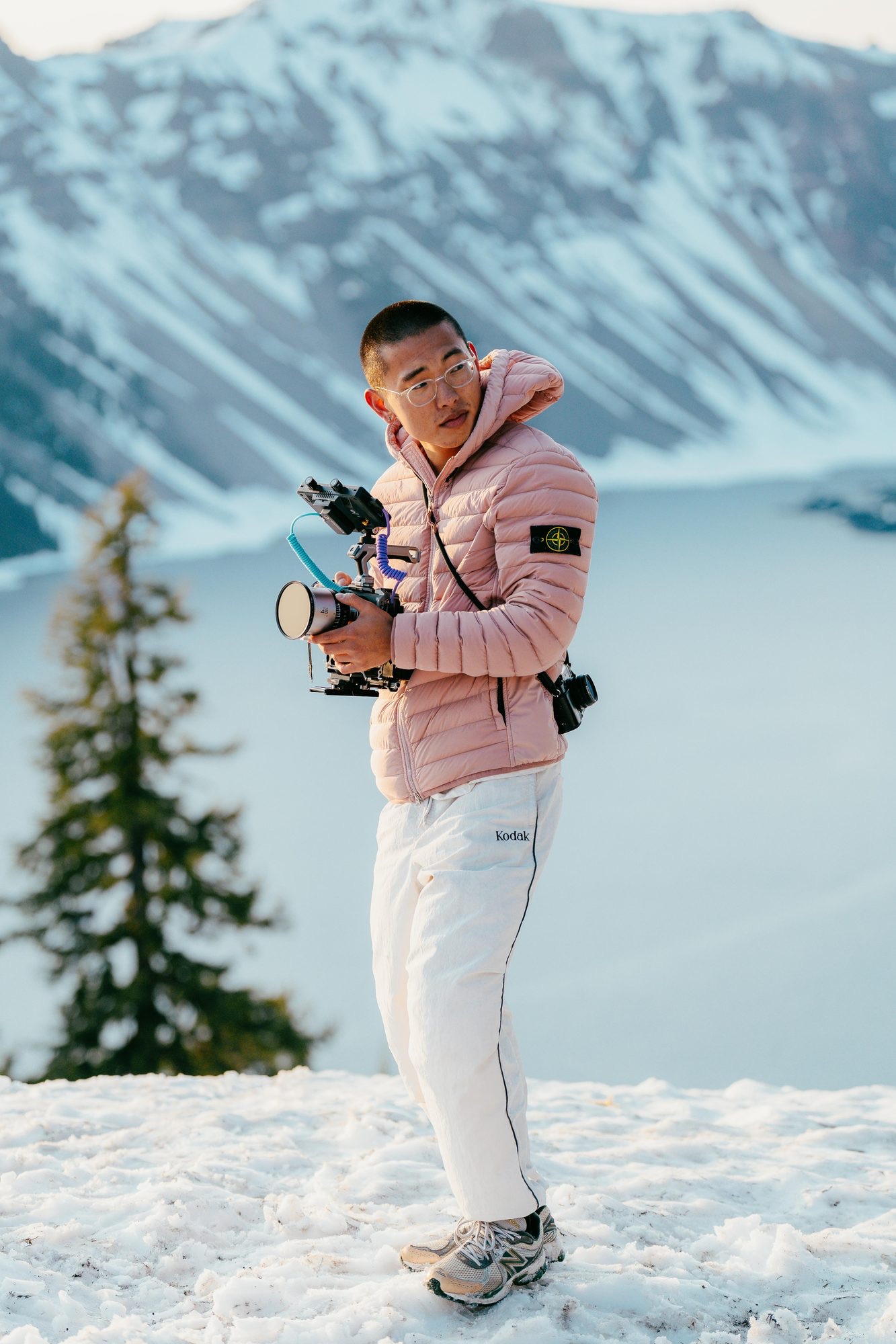 Nicolas Chae filming with a rigged camera on a mountainside