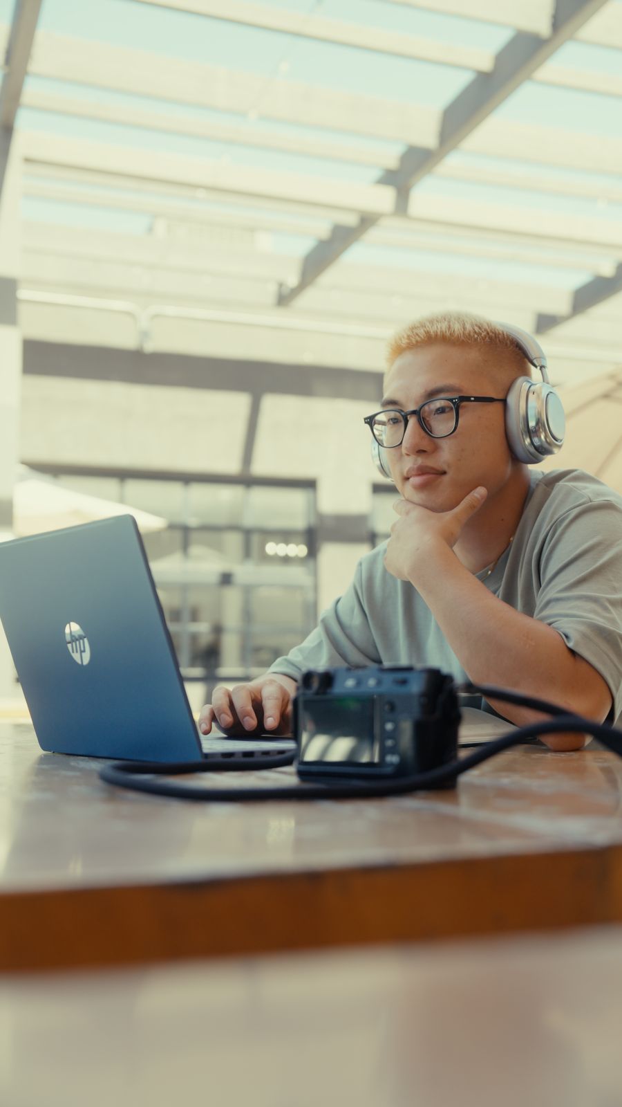 Nicolas Chae editing at his laptop